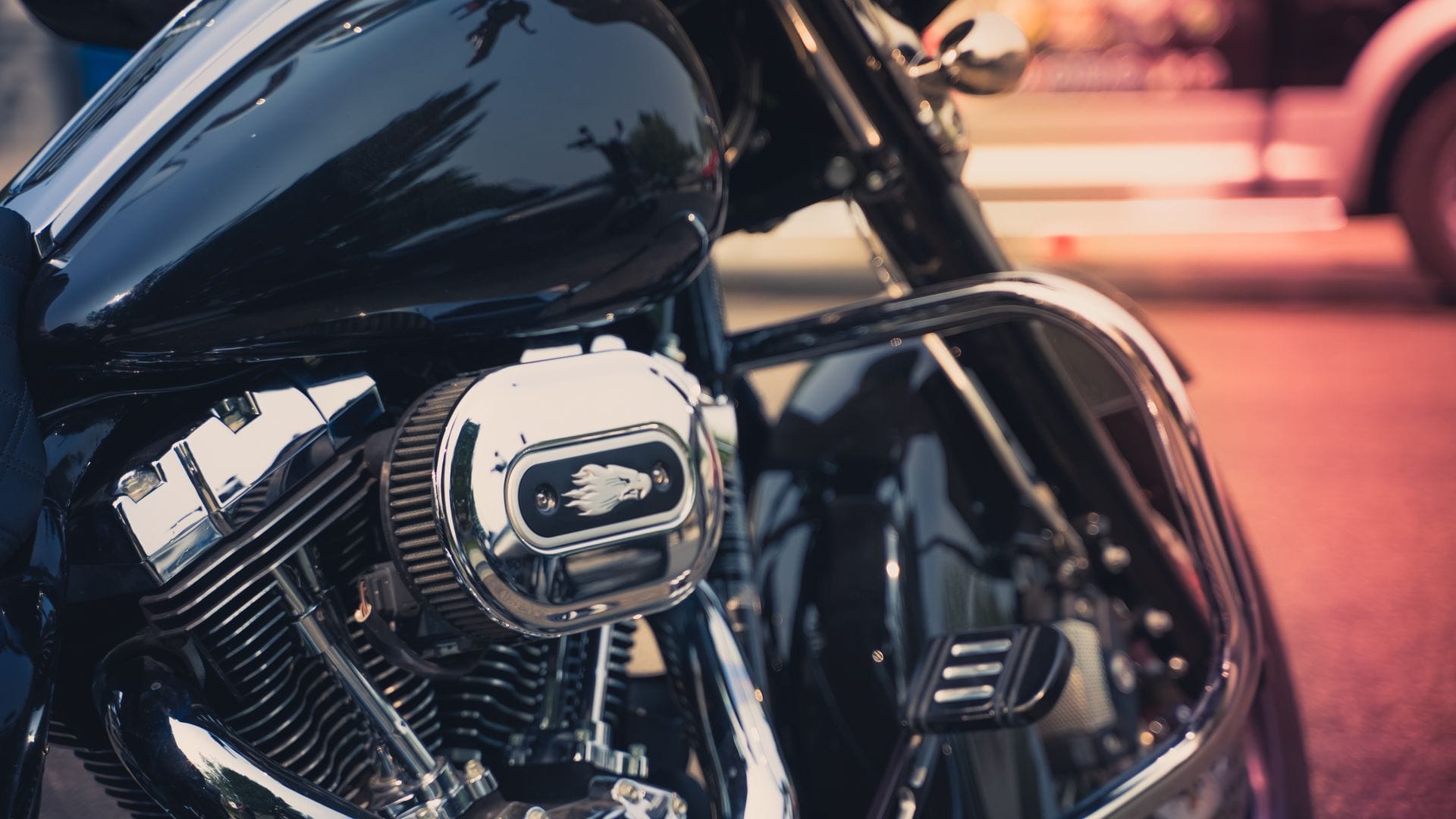 Close-up of a black motorcycle engine with chrome custom details