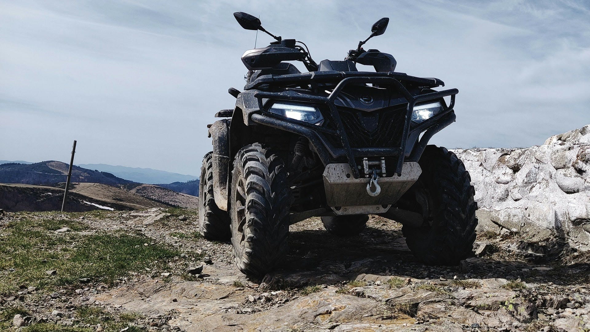 Parked ATV on a rocky trail